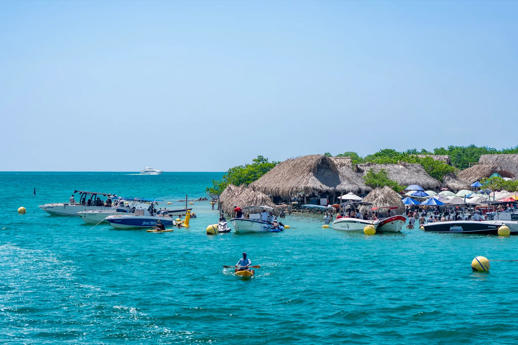 Cabins and boats in the waters of Cholón