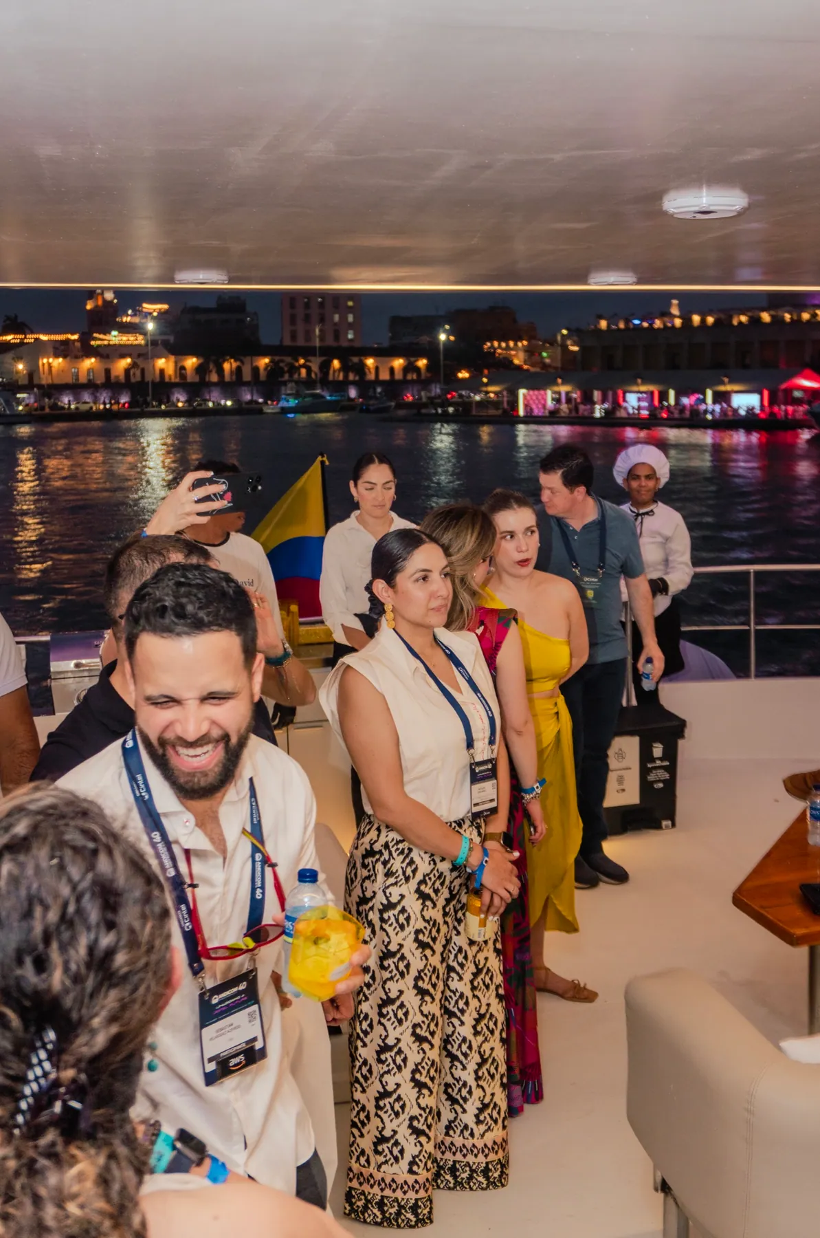 Guests gathered with the Colombian flag onboard Mavi Soul