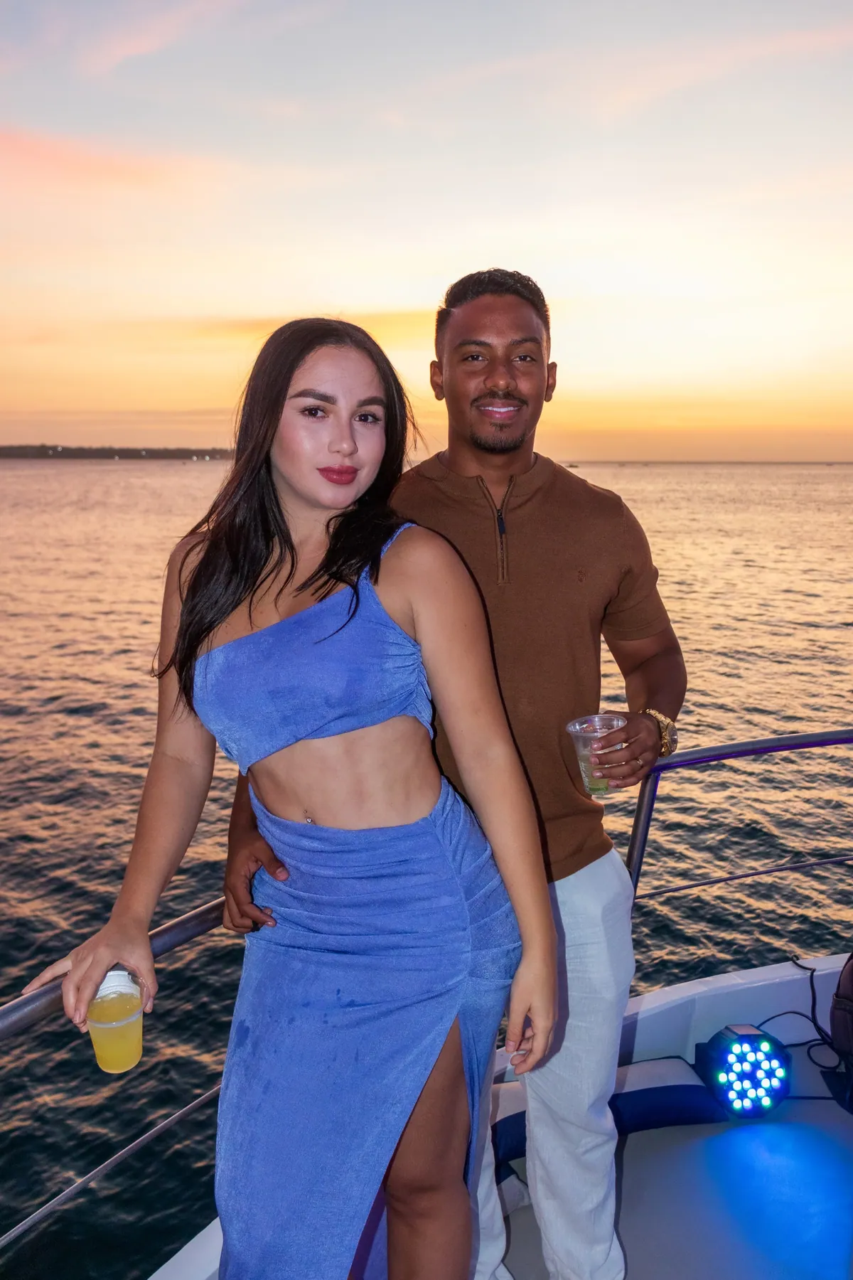 Couple celebrating at sunset onboard Mavi Soul