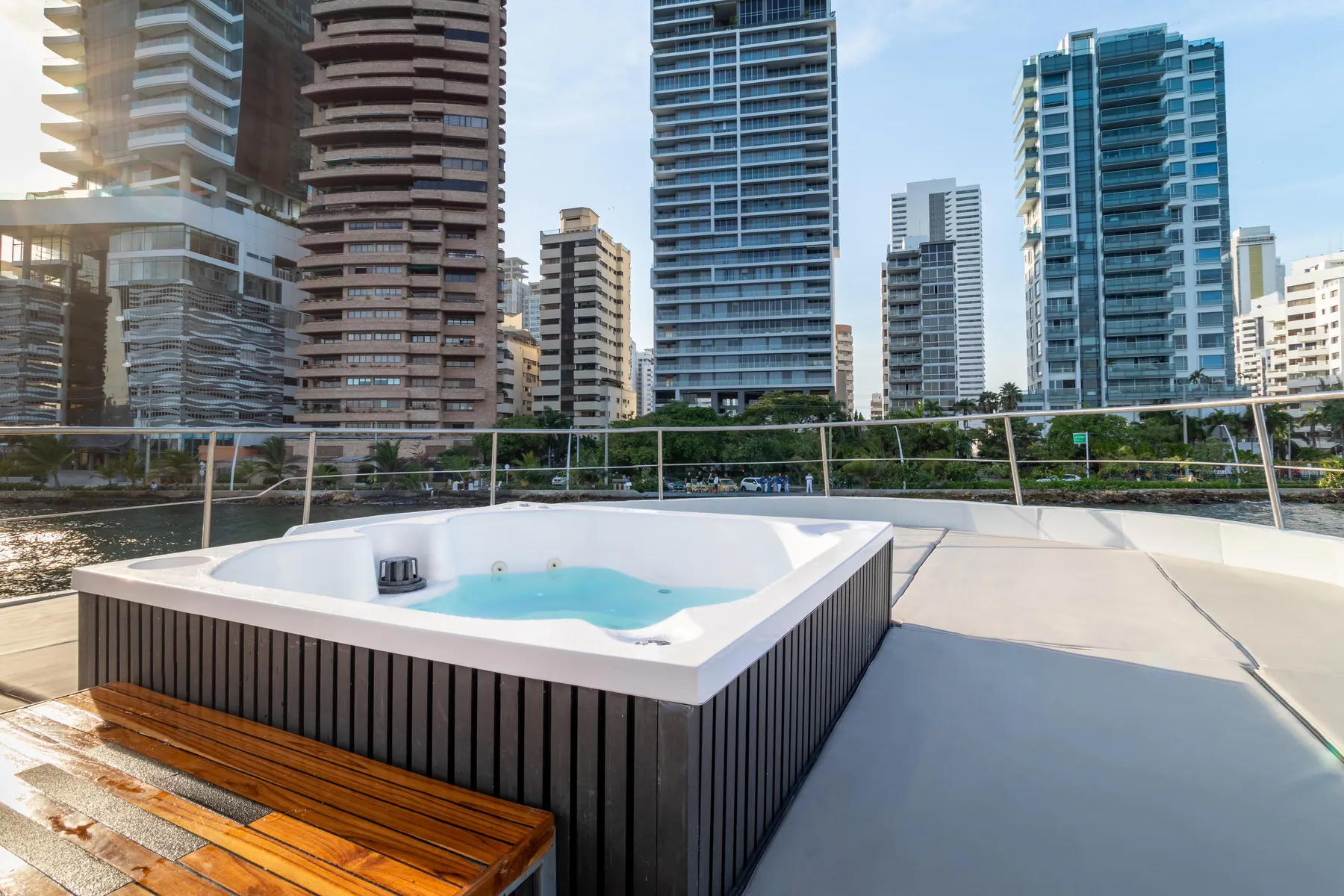 Outdoor dining area onboard Mavi Soul in front of the skyline