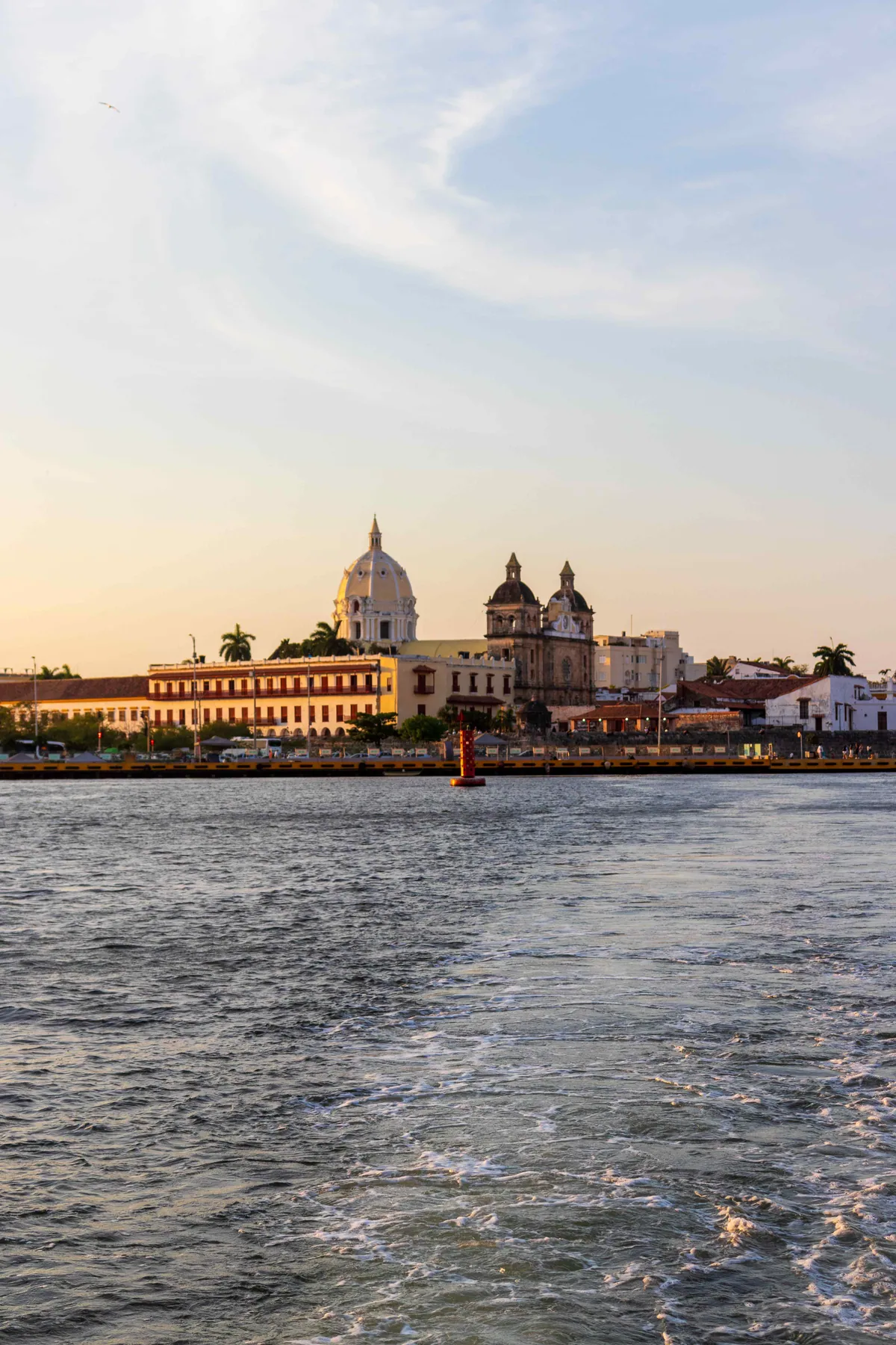 Catamaran sailing in front of the Cartagena skyline