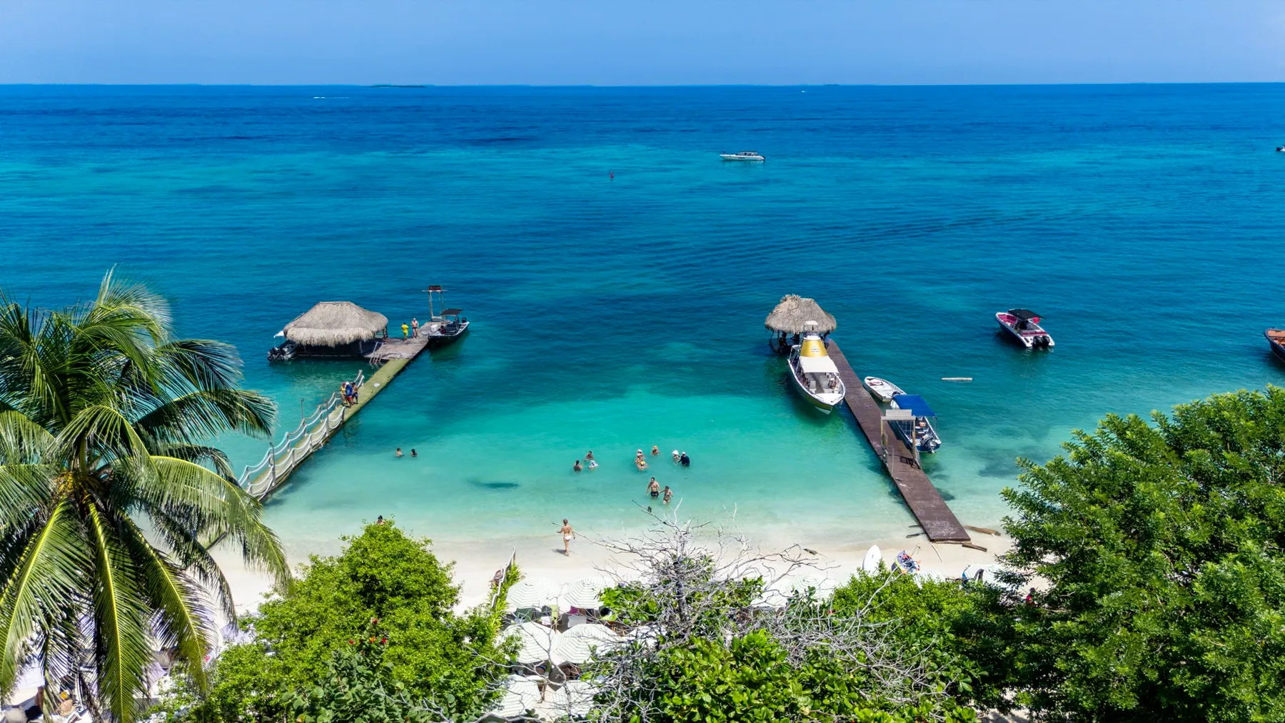 Clear-water beach and docks in the Rosario Islands