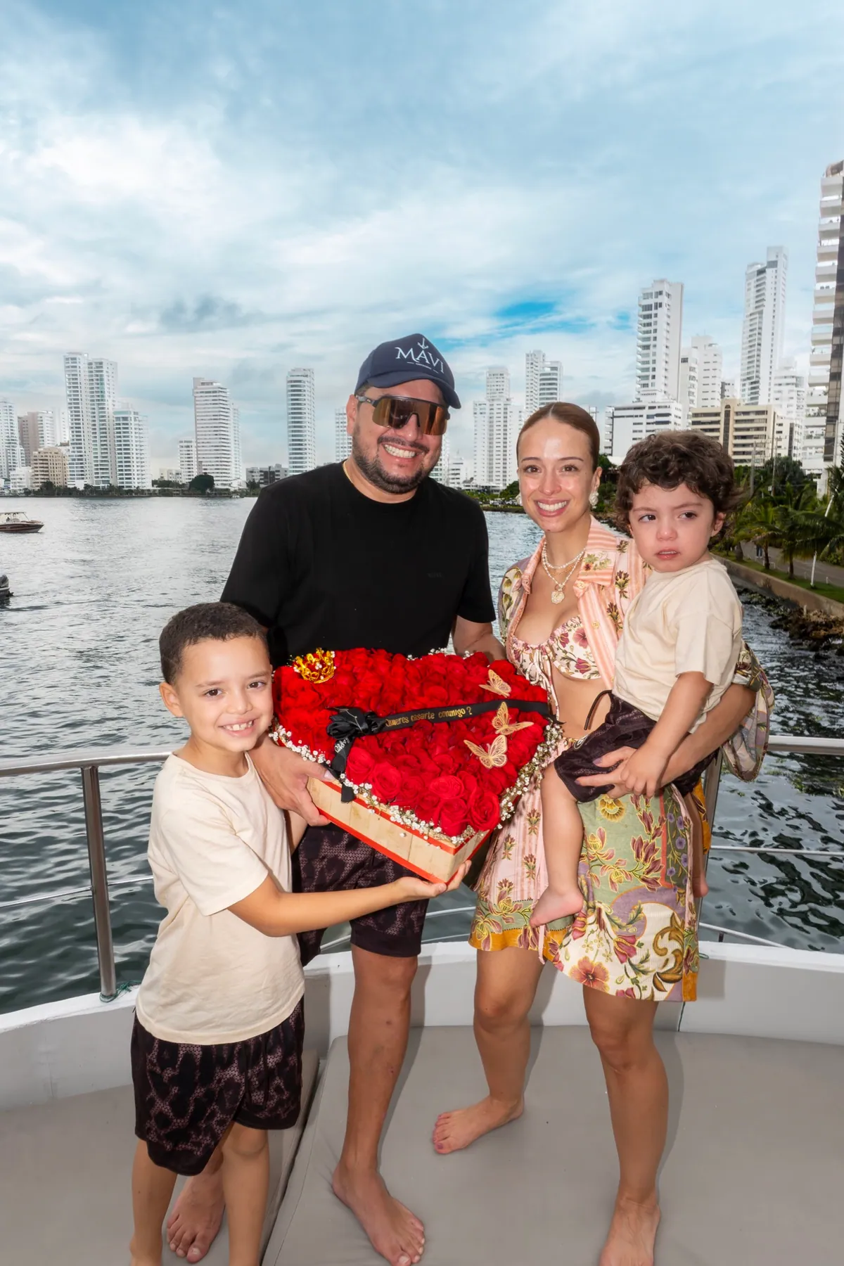 Family celebrating a marriage proposal onboard Mavi Soul