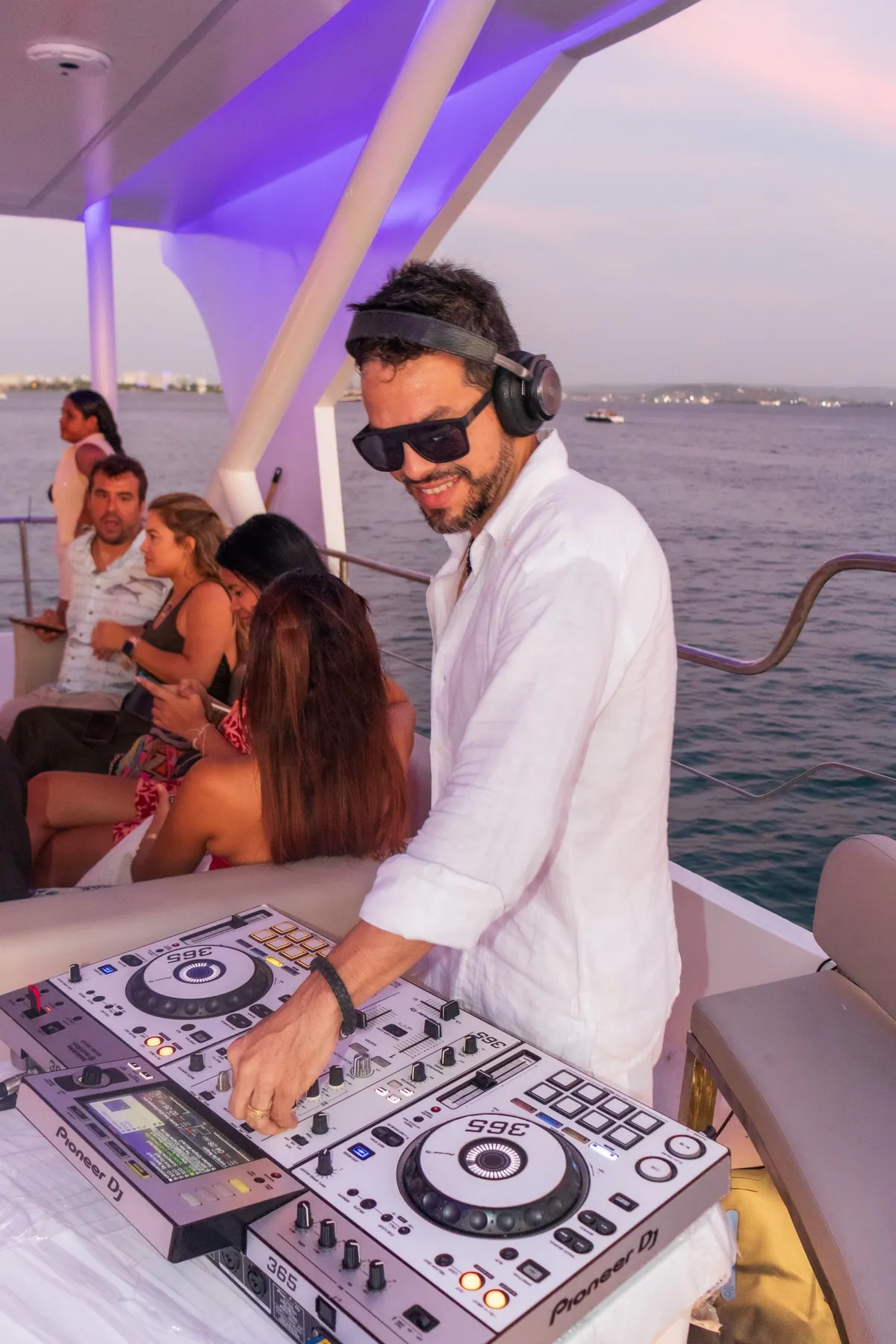 DJ setting the atmosphere onboard Mavi Soul