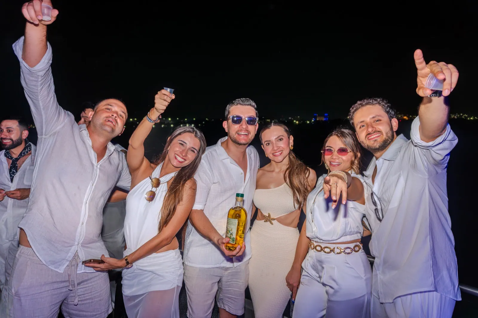 Group of friends celebrating an evening onboard MAVI
